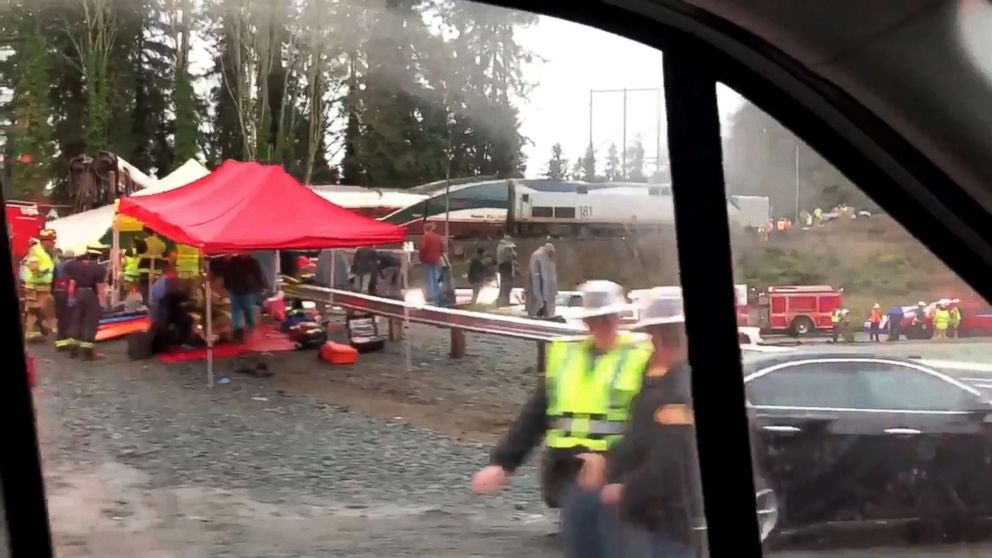 PHOTO: Emergency crews respond next to a derailed Amtrak train in Pierce County, Washington state, Dec. 18, 2017.