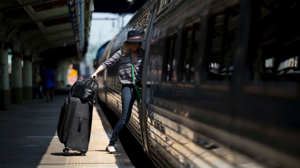 A passenger boards an Amtrak Northeast Regional train at Union Station in Washington, D.C., Sept. 3, 2015.