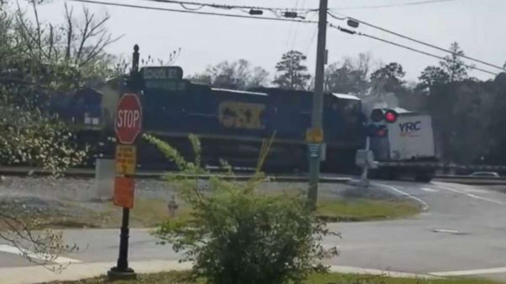Caught on camera: Freight train slams into tractor-trailer in Georgia ...