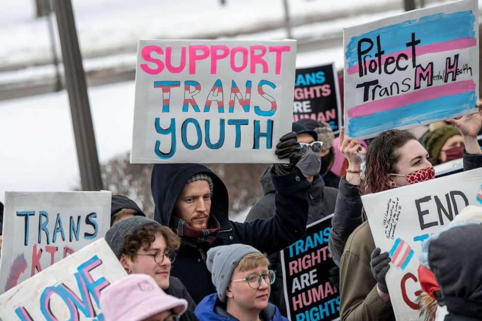 PHOTO: In this March 6, 2022, file photo, people hold a rally at the capitol to support trans kids in Minnesota, Texas, and around the country, in St. Paul, Minn.
