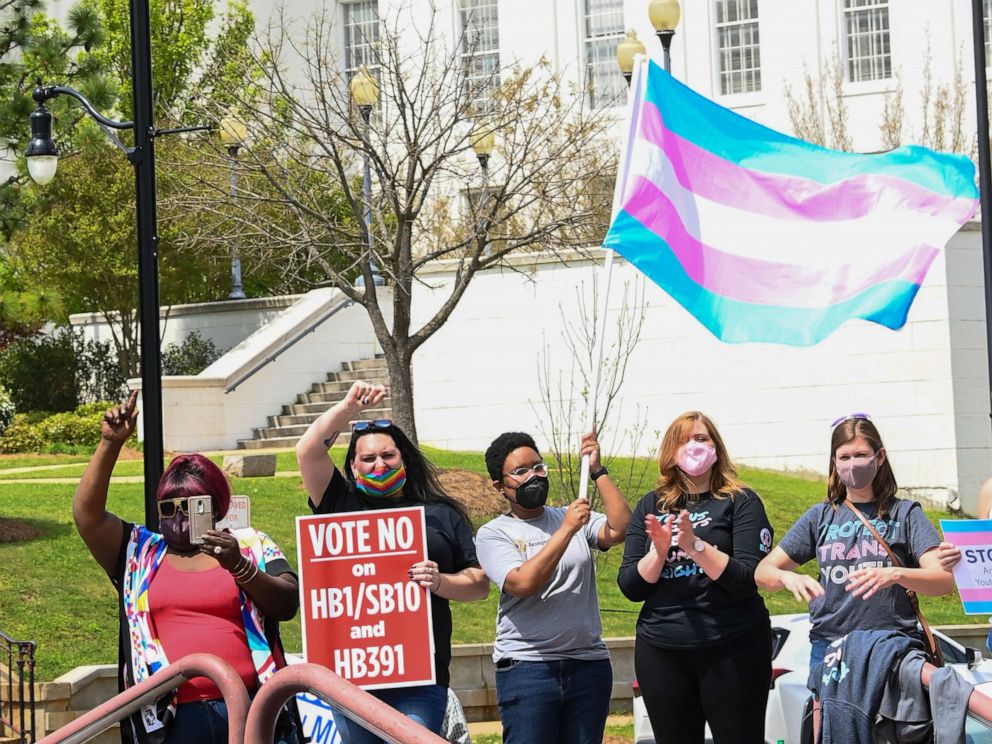 PHOTO: In this March 30, 2021 file photo opponents of several bills targeting transgender youth attend a rally at the Alabama State House to draw attention to anti-transgender legislation, in Montgomery, Ala.