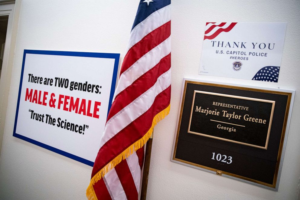 PHOTO: A sign hangs on the wall outside the office of Rep. Marjorie Taylor Greene in the Longworth House Office Building on Capitol Hill, Feb. 25, 2021, in Washington, D.C.