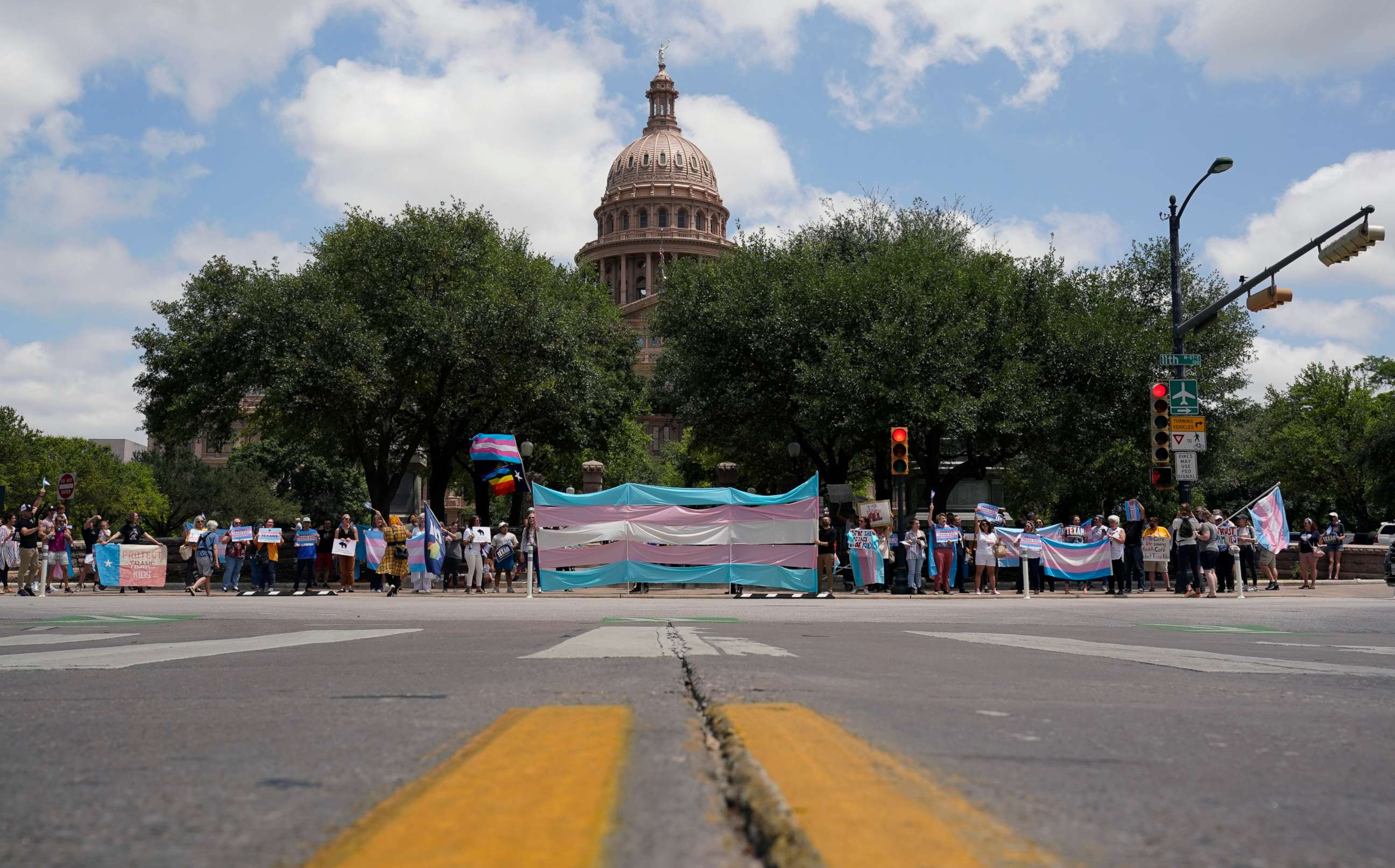 PHOTO: Demonstrators gather on the steps to the State Capitol to speak against transgender related legislation bills being considered in the Texas Senate and Texas House, May 20, 2021, in Austin, Texas.