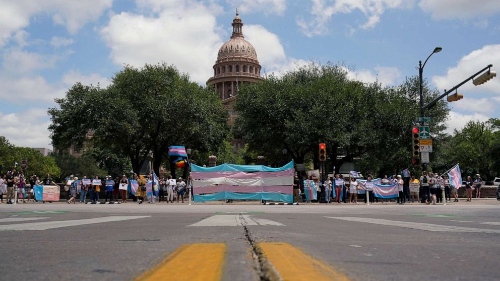 PHOTO: Demonstrators gather on the steps to the State Capitol to speak against transgender related legislation bills being considered in the Texas Senate and Texas House, May 20, 2021, in Austin, Texas.