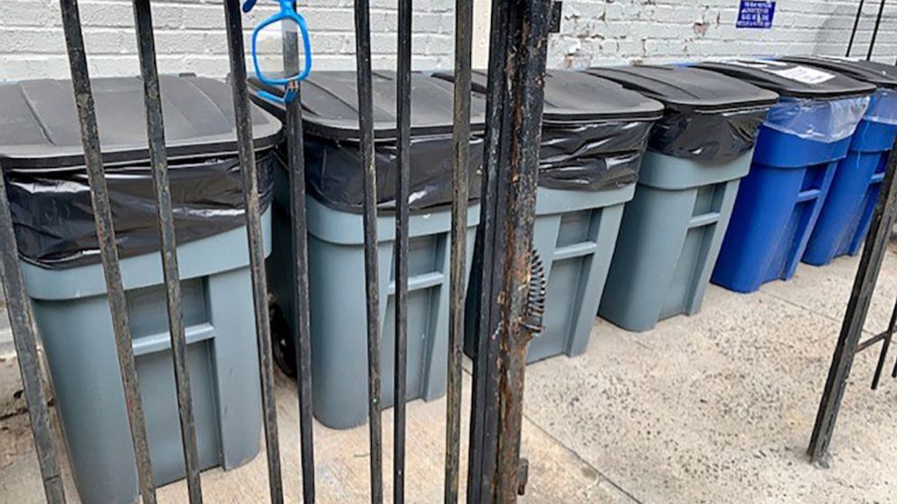 PHOTO: Trash cans sit outside a residential building in New York City, July 29, 2022.