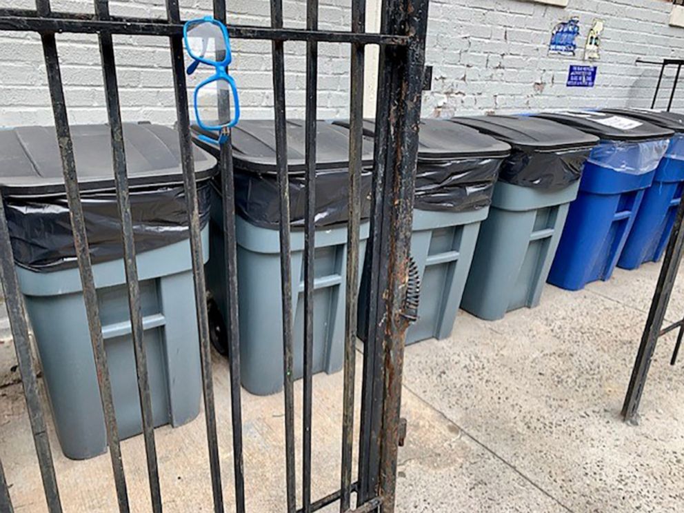 PHOTO: Trash cans sit outside a residential building in New York City, July 29, 2022.