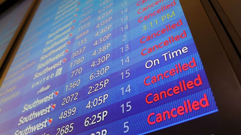 PHOTO: The arrival and departures board lists numerous flight cancelations at Tampa International Airport before the airport is due to close at 5pm today ahead of Hurricane Ian in Tampa, Fla., Sept. 27, 2022.
