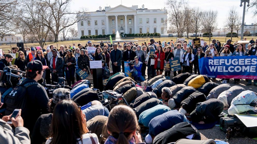 PHOTO: Supporters surround an Islamic midday prayer outside the White House in Washington, Jan. 27, 2018, during a rally on the one-year anniversary of the Trump Administration's first partial travel ban on citizens from seven Muslim majority countries. 