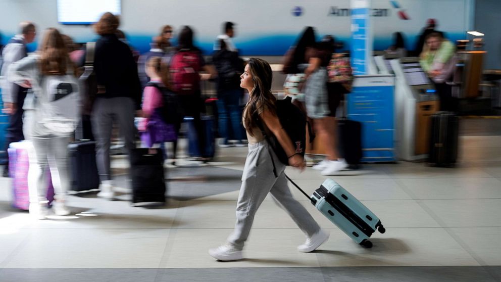 PHOTO: A person walks by the ticketing lobby at the Charlotte Douglas International Airport on May 25, 2023, in Charlotte, N.C., as the summer travel season begins.