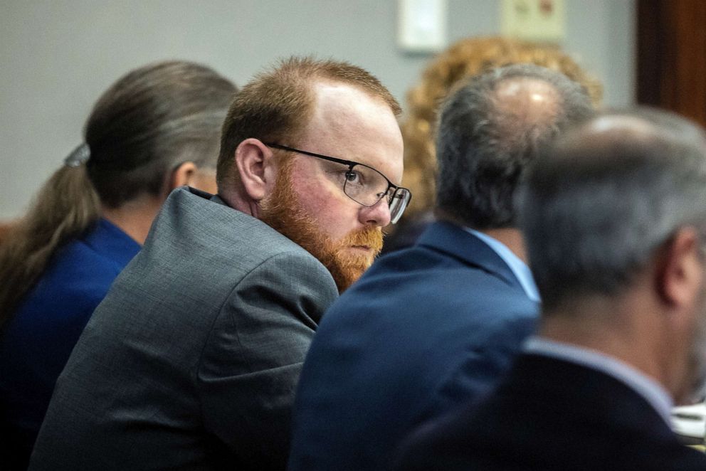 PHOTO: Travis McMichael sits with his attorneys before the start of closing arguments to the jury during his trial and of his father Gregory McMichael and William "Roddie" Bryan, charged with the February 2020 death of 25-year-old Ahmaud Arbery.