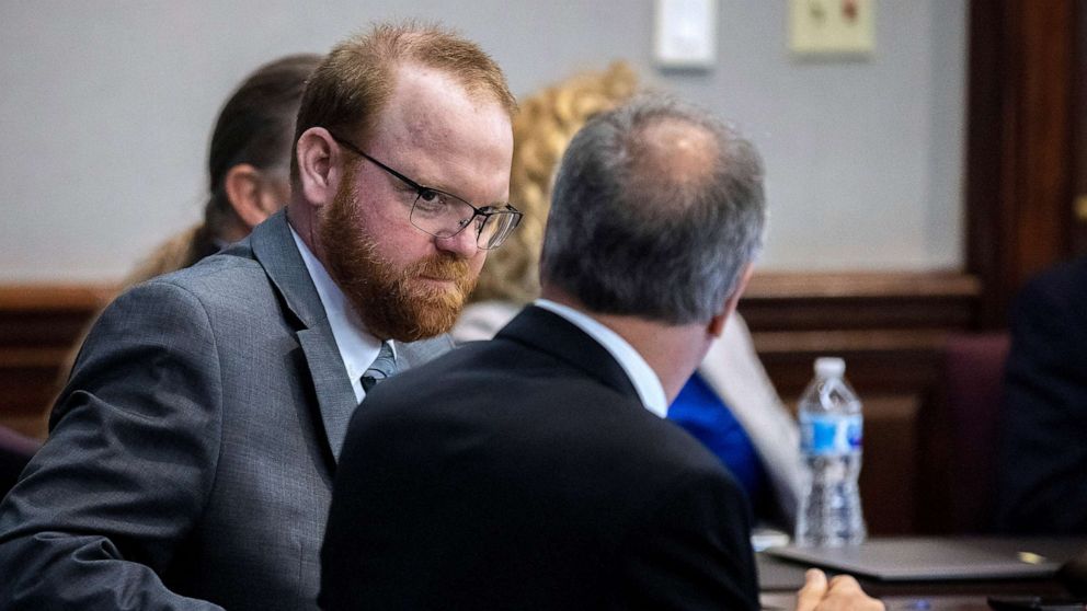 PHOTO: Defendant Travis McMichael speaks with his attorney Bob Rubin while they wait for the jury to return during the trial of McMichael and his father, Greg McMichael, and a neighbor, William "Roddie" Bryan, Nov. 24, 2021, in Brunswick, Ga.