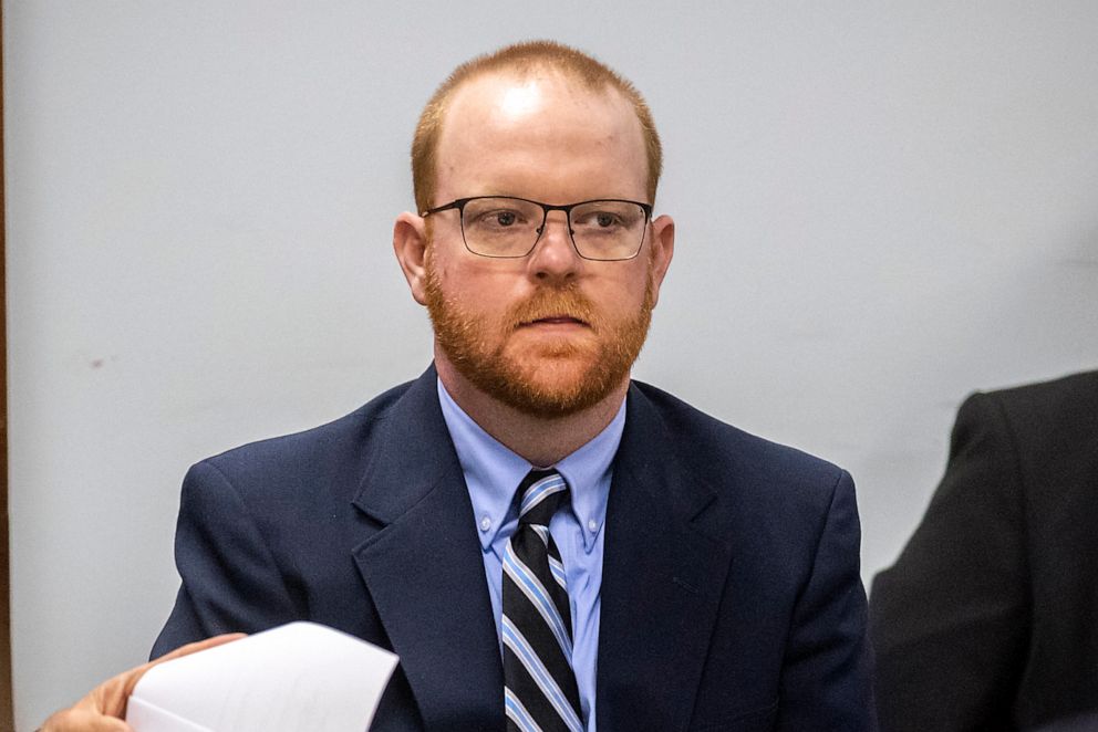 PHOTO: Travis McMichael listens to attorneys question a pool of prospective jurors during jury selection for the trial of he and his father Greg McMichael and William "Roddie" Bryan, at the Glynn County Courthouse, Oct. 25, 2021, in Brunswick, Ga.