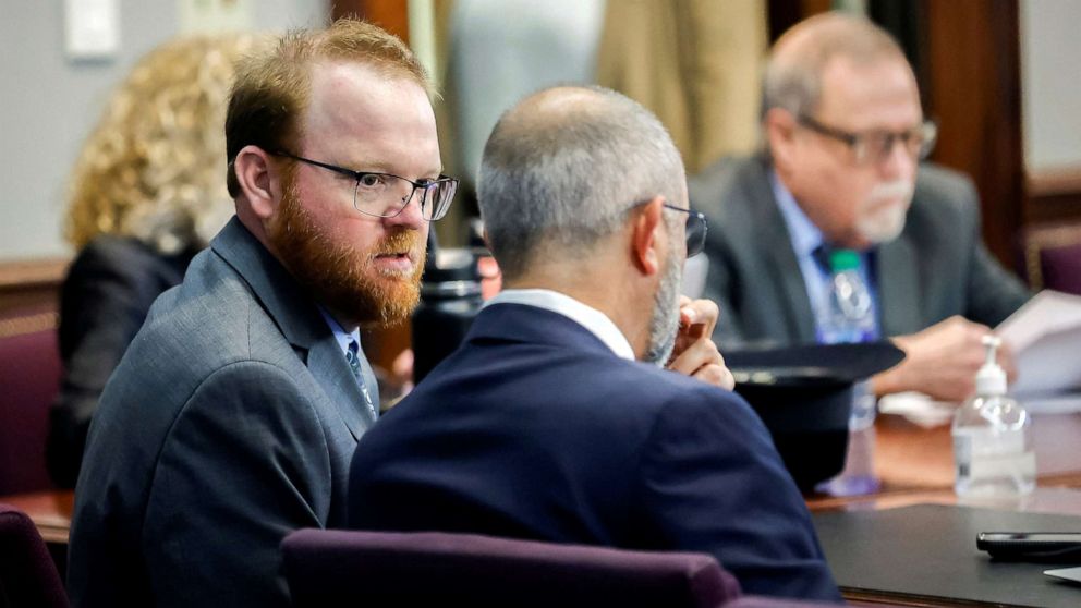 PHOTO: Travis McMichael, left, speaks with his attorney Jason B. Sheffield during sentencing for the killing of Ahmaud Arbery in the Glynn County Courthouse, in Brunswick, Ga., Jan. 7, 2022.