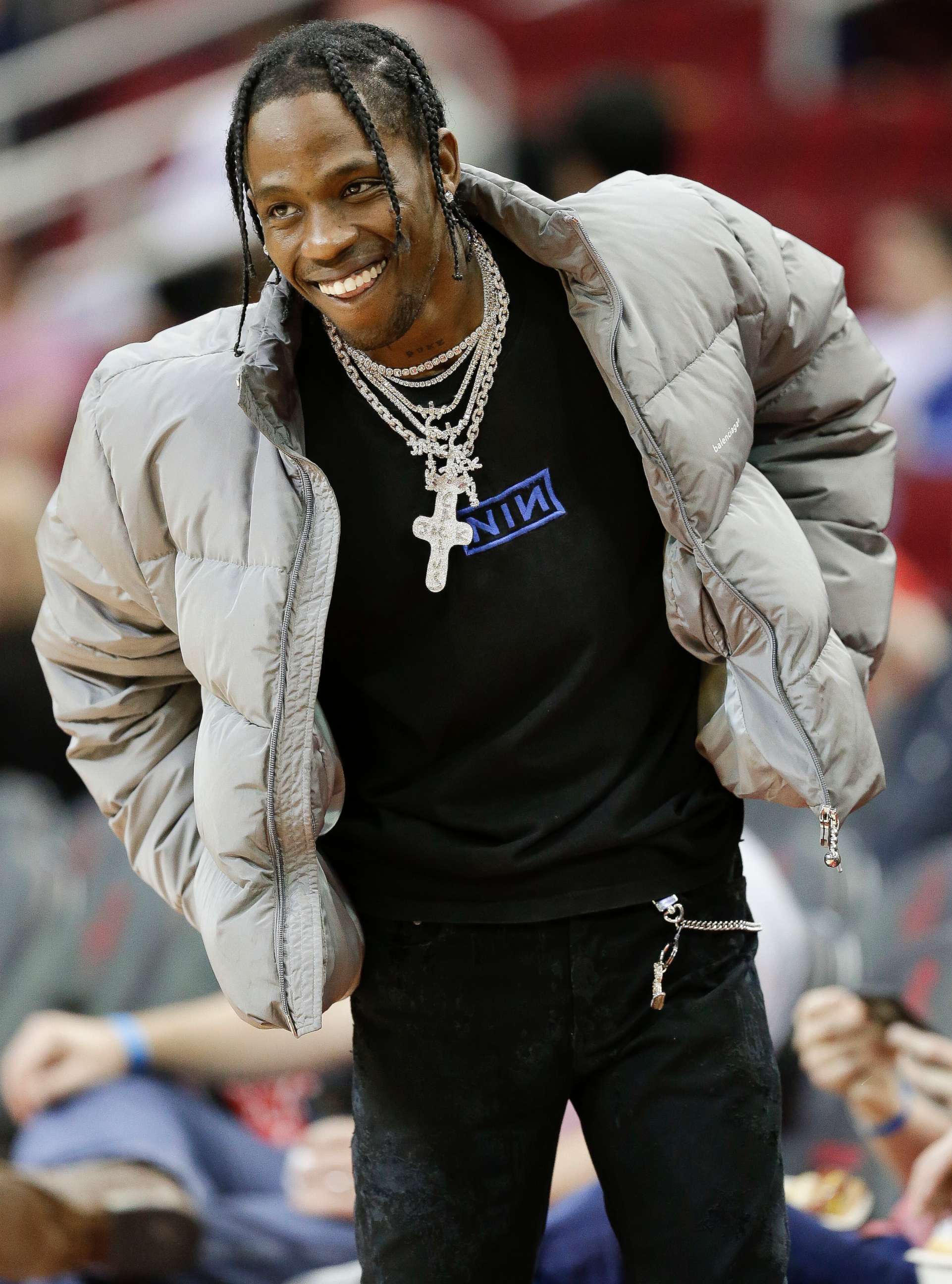 PHOTO: Hip hop artist Travis Scott watches warmups before an NBA basketball game between the Houston Rockets and the Denver Nuggets, in Houston, Feb. 9, 2018.