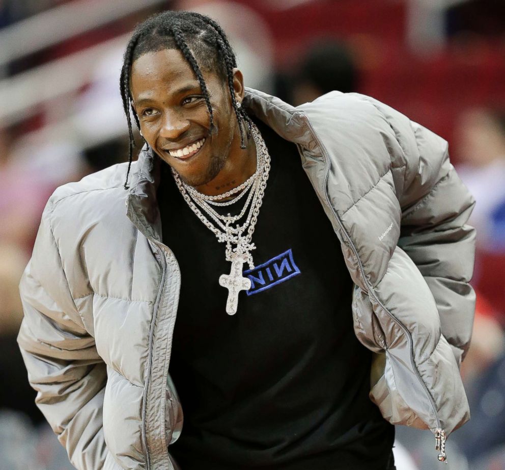 PHOTO: Hip hop artist Travis Scott watches warmups before an NBA basketball game between the Houston Rockets and the Denver Nuggets, in Houston, Feb. 9, 2018.