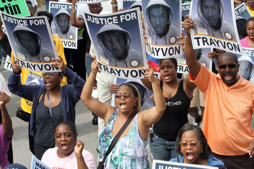 PHOTO: Thousands of demonstrators march along W. 13th Street in Sanford, Florida, during a NAACP rally and march demanding for justice in the shooting of Trayvon Martin, March 31, 2012.