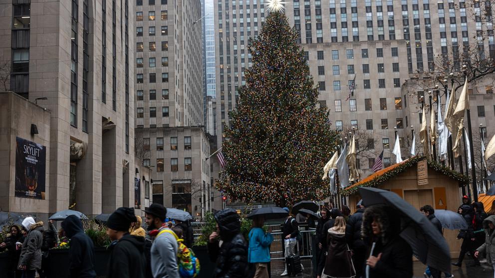 PHOTO: People walk through Rockefeller Center a little over a week before Christmas, Dec. 16, 2024, in New York.
