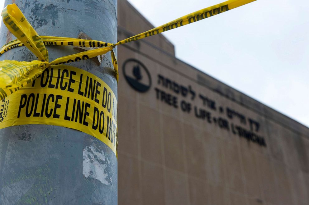 PHOTO: Police tape wrapped around a traffic light pole out front of the Tree of Life Synagogue in Squirrel Hill outside of Pittsburgh.