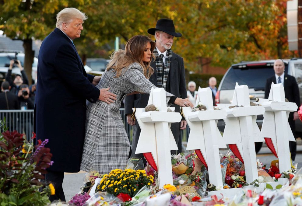 PHOTO: President Donald Trump and first lady Melania Trump place stones on a memorial to shooting victims as they stand with Tree of Life Synagogue Rabbi Jeffrey Myers outside the synagogue in Pittsburgh, Oct. 30, 2018.