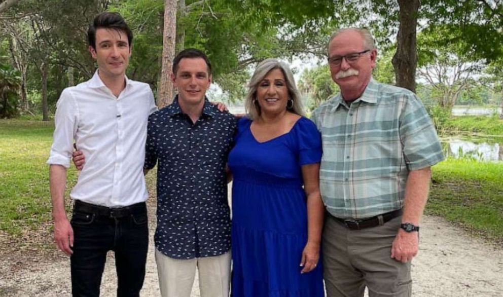 PHOTO:  ABC News reporter Patrick Reevell stands with Marine veteran Trevor Reed and Reeds parents, Paula and Joey Reed, May 21, 2022.