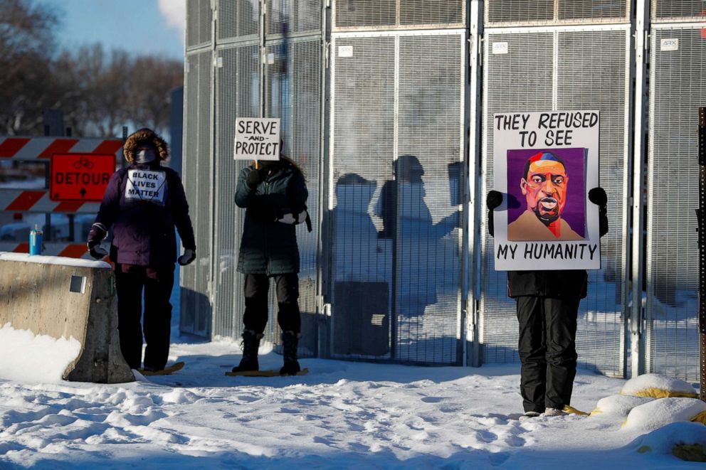 PHOTO: Protesters stand outside the Warren E. Burger Federal Building, Jan. 24, 2022,  before opening arguments in the civil trial of three former Minneapolis police officers, Tou Thao, J. Alexander Kueng and Thomas Lane.