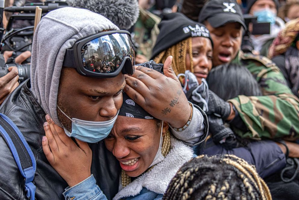 PHOTO: People react to the guilty verdict in the  State v. Derek Chauvin trial at the location near Cup Foods in Minneapolis, Minn., Apr 20, 2021.