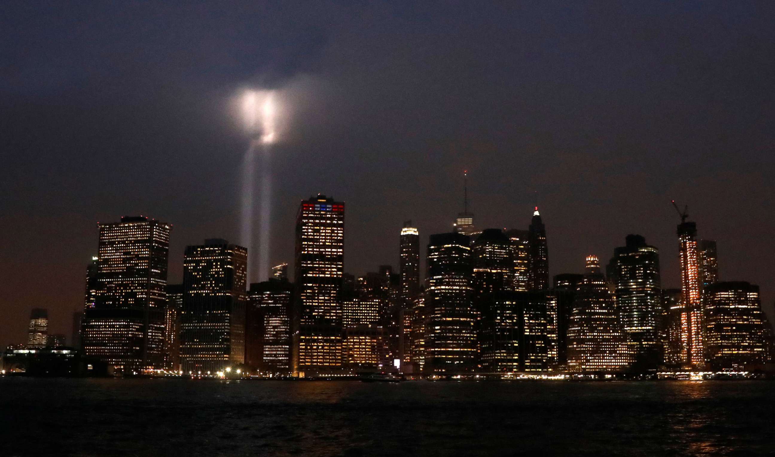 PHOTO: The Tribute in Light installation is illuminated over lower Manhattan as seen from Brooklyn, September 11, 2018.