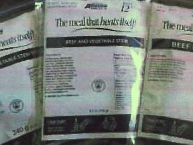 PHOTO: A photo in Tribute Contracting, LLCs contract with a catering company show examples of self heating meals that include a meal in one pouch with a food heater, water pouch, cutlery, and seasonings.