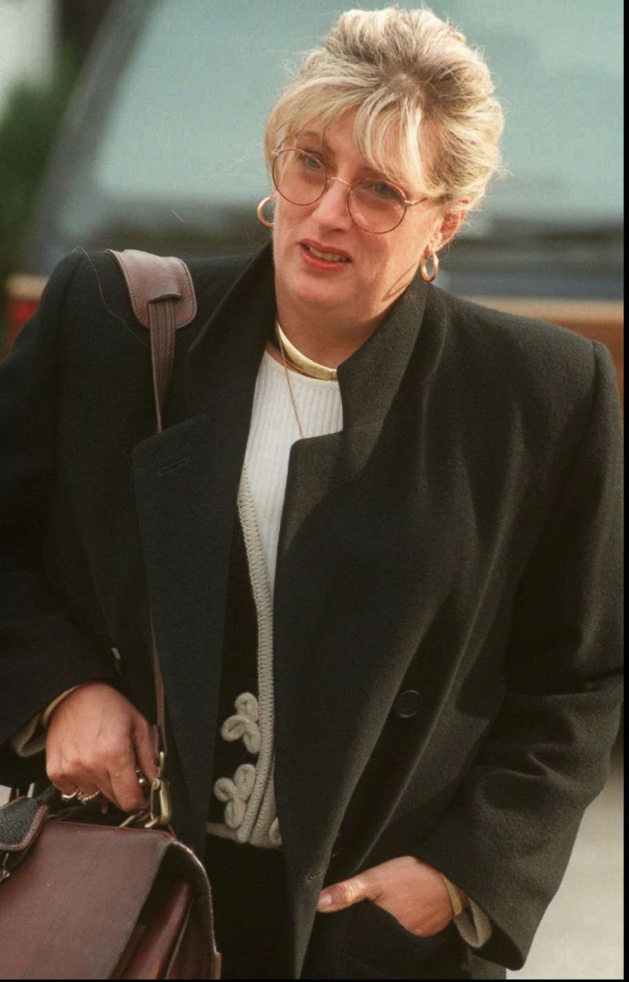 PHOTO: Former White House staffer Linda Tripp leaves her home in Columbia, Md., Jan. 21, 1998. 