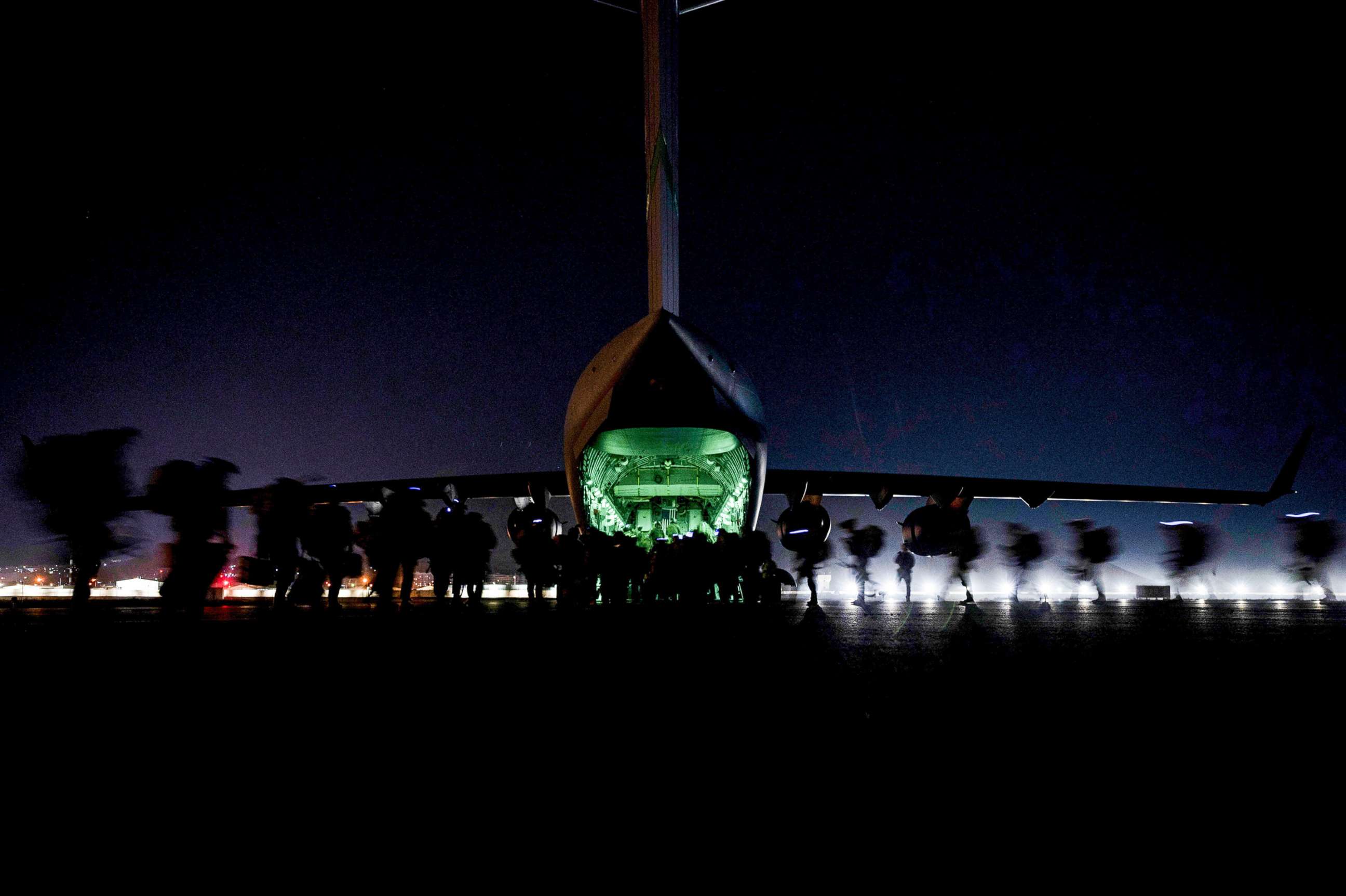 PHOTO: In this Aug. 30, 2021, file photo, U.S. Soldiers, assigned to the 82nd Airborne Division, prepare to board a U.S. Air Force C-17 Globemaster III aircraft to leave Hamid Karzai International Airport in Kabul, Afghanistan.