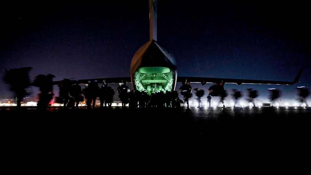PHOTO: In this Aug. 30, 2021, file photo, U.S. Soldiers, assigned to the 82nd Airborne Division, prepare to board a U.S. Air Force C-17 Globemaster III aircraft to leave Hamid Karzai International Airport in Kabul, Afghanistan.
