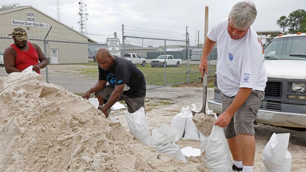 PHOTO: Gulfport, Miss., residents shovel sand into bags at a Harrison County Road Department sand bagging location, while preparing for Subtropical Storm Alberto to make its way through the Gulf of Mexico, May 26, 2018.