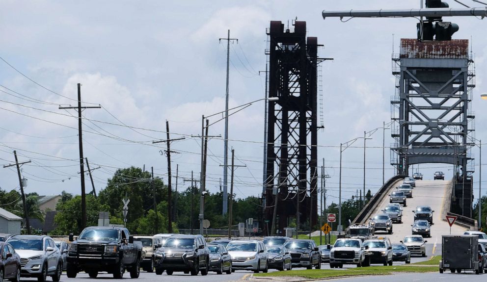 PHOTO: People drive away from low lying areas in Plaquemines Parish, La., July 11, 2019.