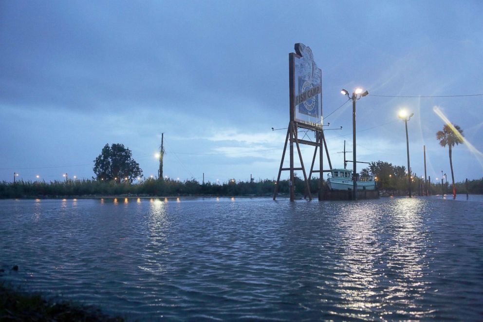 PHOTO: A flooded parking lot sits near a shutdown portion of US Highway 98 from Tropical Storm Gordon, Sept. 5, 2018, in Spanish Fort, Ala.