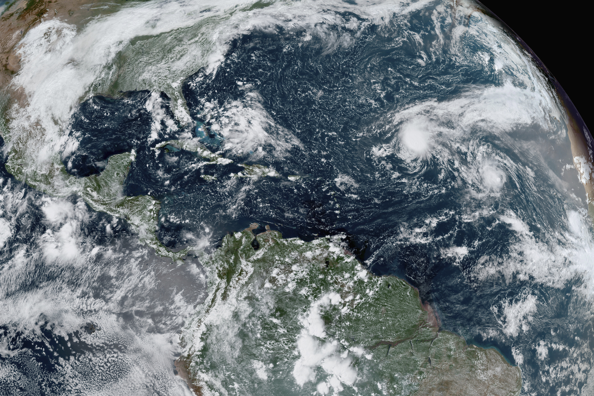 PHOTO: This GOES-16 GeoColor satellite image taken Thursday, Sept. 10, 2020, and provided by NOAA, shows tropical storms forming in the Atlantic. 