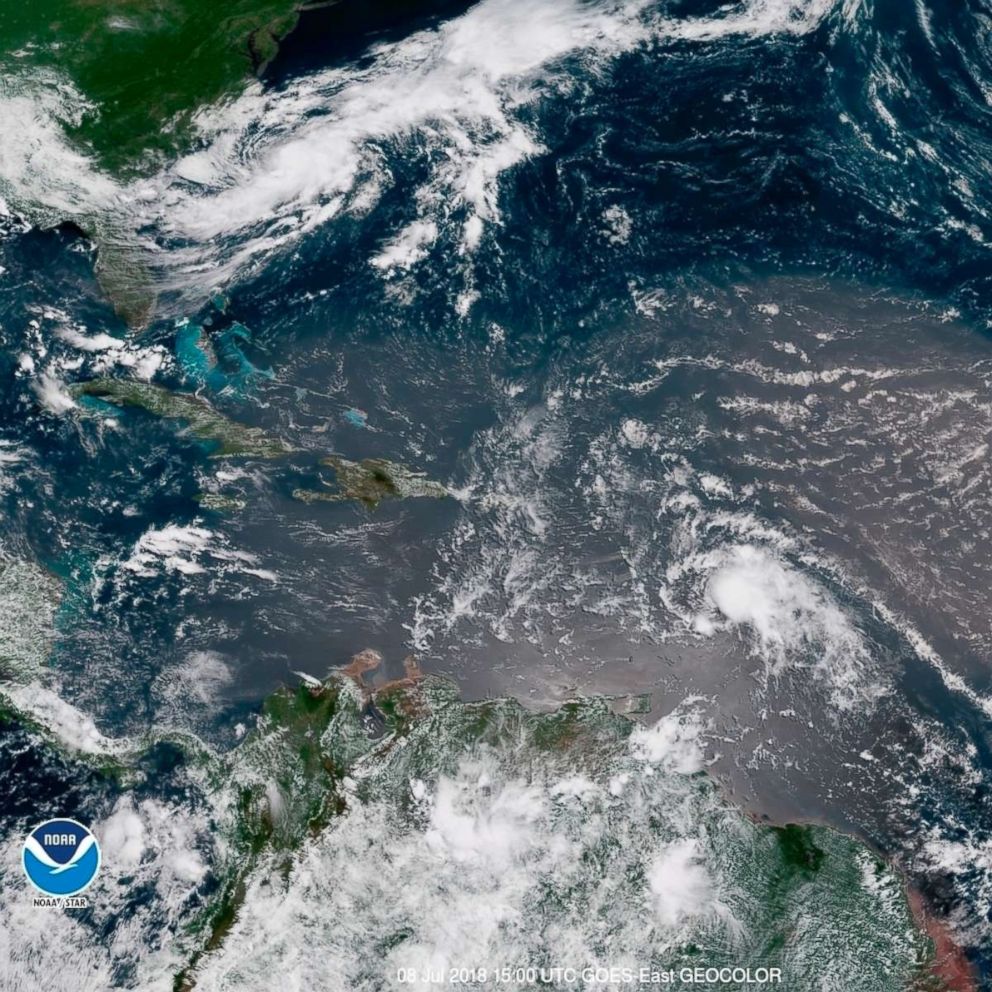 PHOTO: In this geocolor image GOES-16 satellite image taken July 8, 2018, at 15:00 UTC, shows Tropical Storm Beryl, center right, moving across the Lesser Antilles in the eastern Caribbean Sea, and Tropical Storm Chris, top left, off the U.S. East Coast.