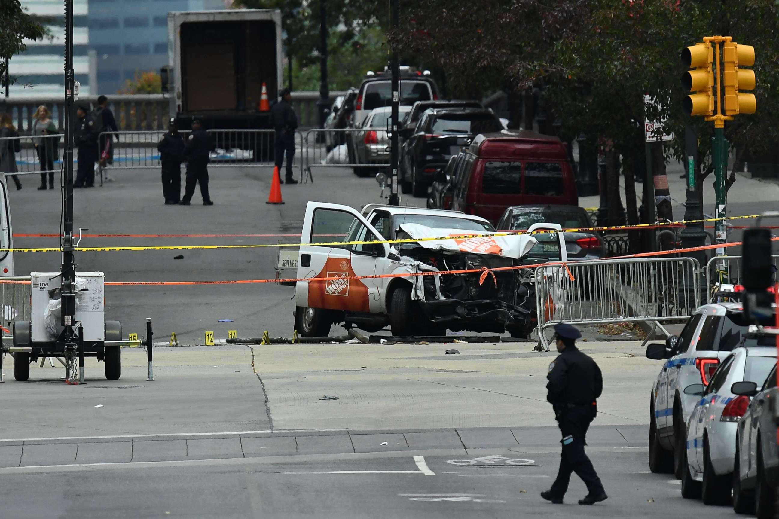 PHOTO: A police officer walks past the wreckage of a Home Depot pickup truck, a day after it was used in an terror attack, in New York City, Nov. 1, 2017.