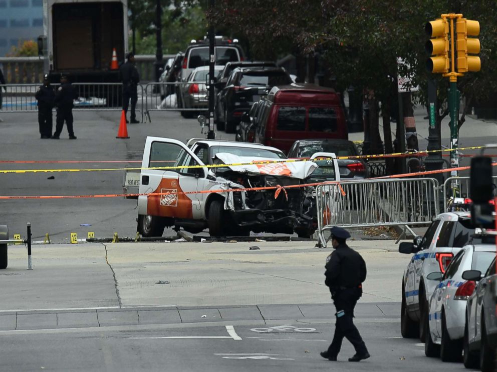 PHOTO: A police officer walks past the wreckage of a Home Depot pickup truck, a day after it was used in an terror attack, in New York City, Nov. 1, 2017.