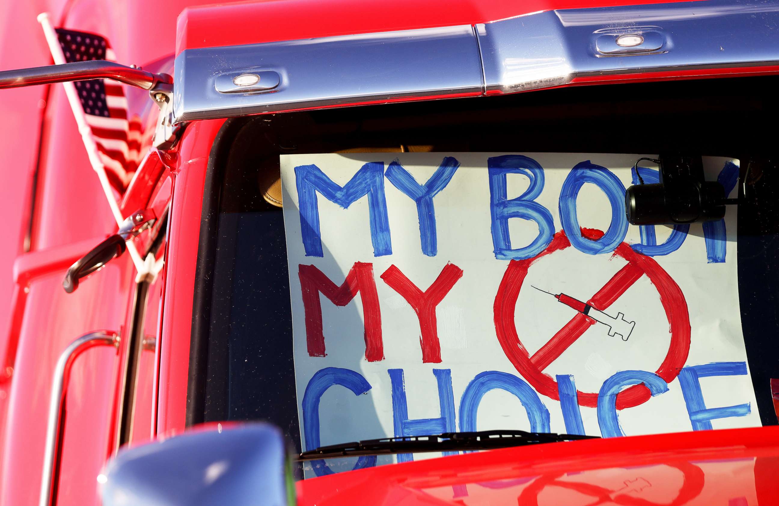 PHOTO: A "My Body My Choice" sign is displayed in a truck in California as truck drivers and supporters gather before a "People's Convoy" departs for Washington, DC to protest COVID-19 mandates on Feb. 22, 2022.
