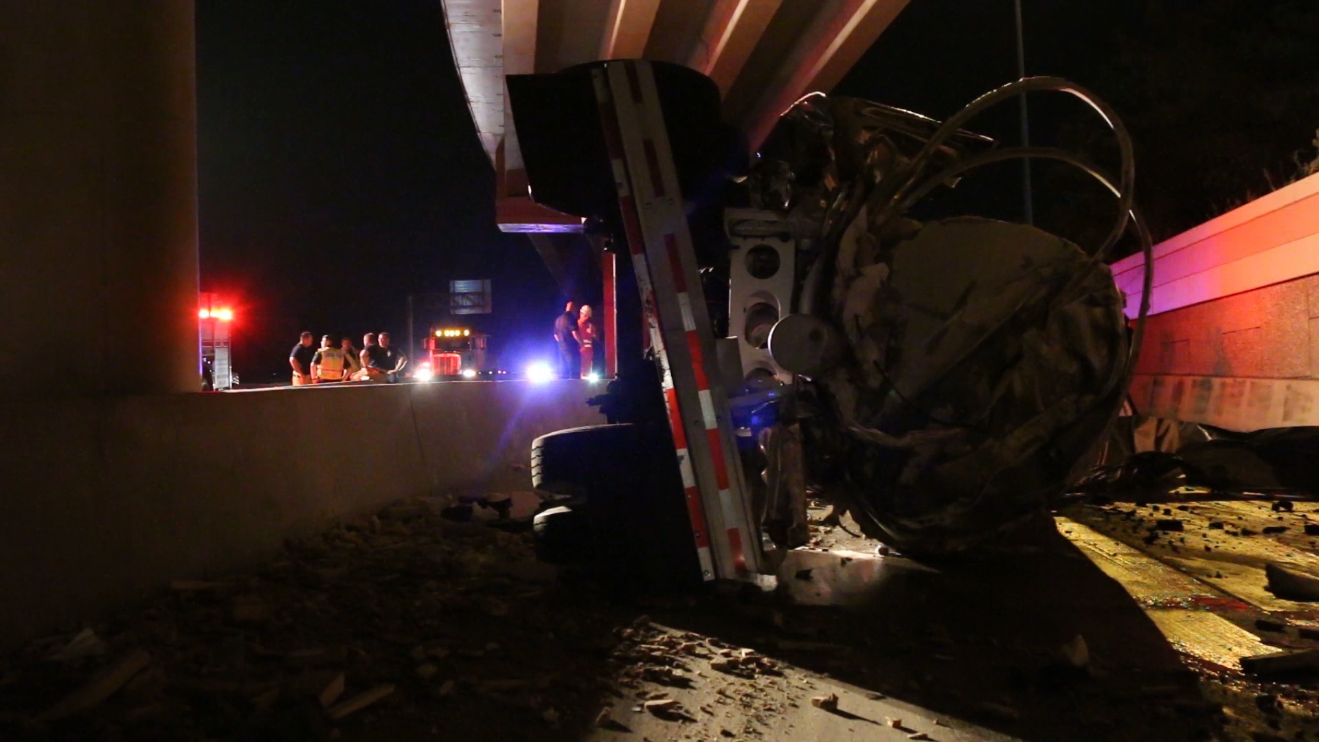 PHOTO: A tanker truck drove off a 40-foot overpass in Lufkin, Texas, breaking into two pieces with the cab landing the southbound lane where police officers managed to rescue the driver while the other half burned nearby.