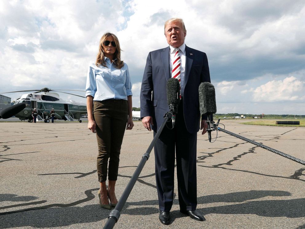 PHOTO: President Donald Trump, with first lady Melania Trump, speaks to the media before boarding Air Force One in Morristown, N.J., Aug. 4, 2019.