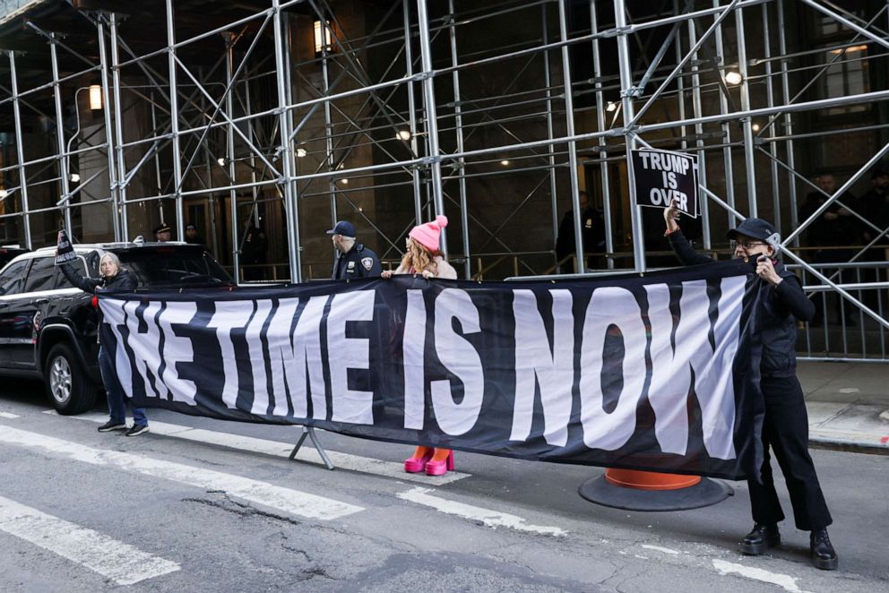 PHOTO: Demonstrators hold a banner after former President Donald Trump's indictment by a Manhattan grand jury following a probe into hush money paid to porn star Stormy Daniels, in New York, March 30, 2023.