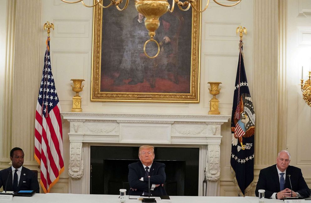 PHOTO: President Donald Trump is flanked by Kentucky Attorney General Daniel Cameron and Fraternal Order of Police National President Patrick Yoes during a roundtable discussion with law enforcement at the White House, June 8, 2020. 