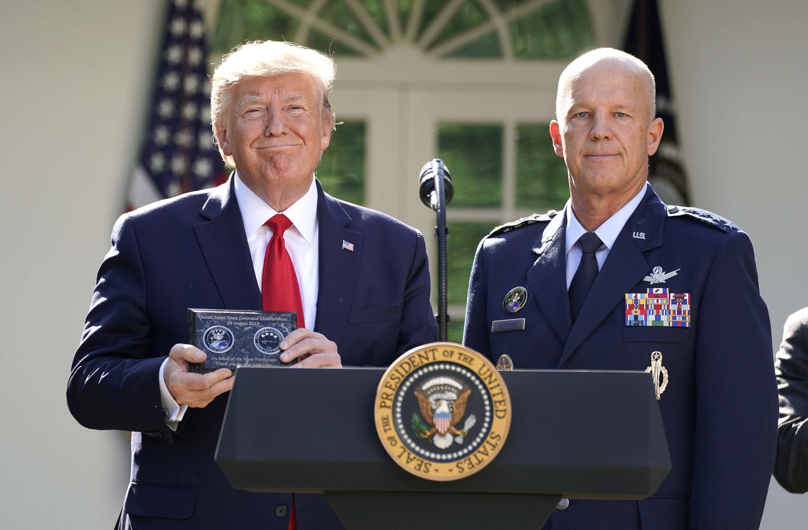 PHOTO: President Donald Trump stands with General John Raymond, incoming U.S. Space Command commander, during an event to officially launch the United States Space Command in the Rose Garden of the White House, Aug. 29, 2019