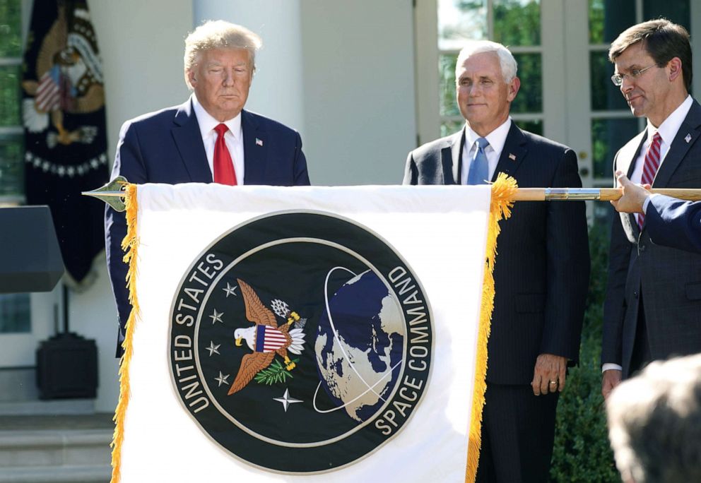 PHOTO:President Donald Trump stands behind a U.S. Space Command flag with Vice President Mike Pence and Defense Secretary Mark Esper at an event to officially launch the United States Space Command in the Rose Garden of the White House, Aug. 29, 2019. 