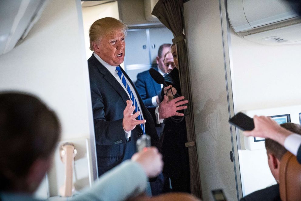 PHOTO: President Donald Trump speaks with reporters aboard Air Force One on April 5, 2018. 