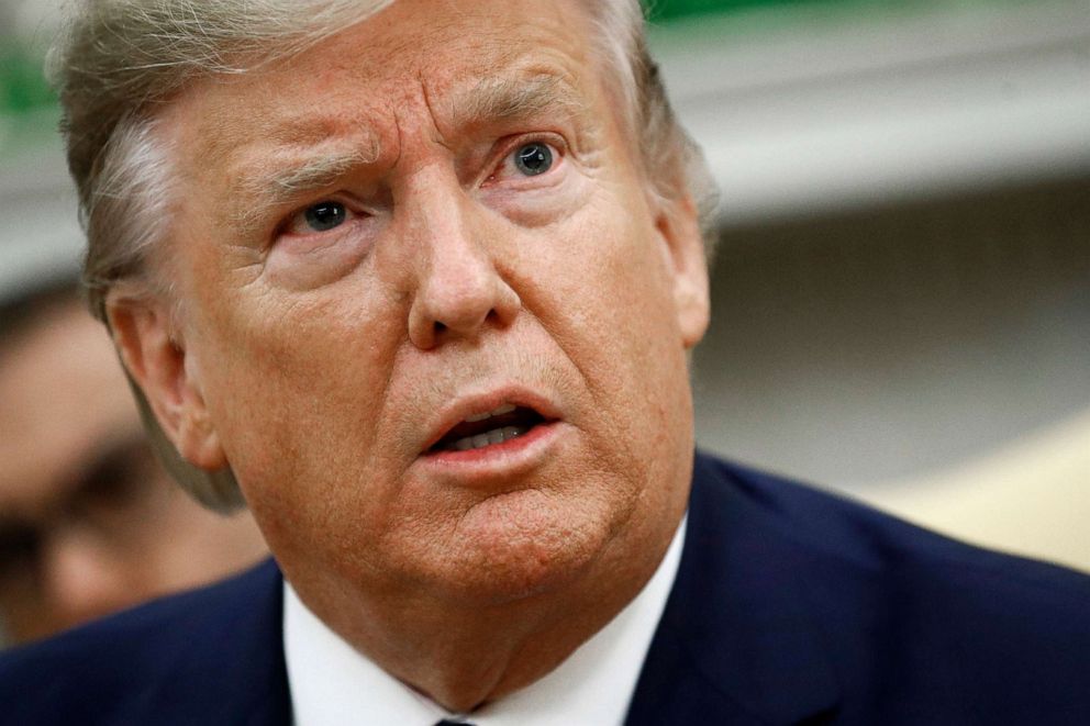 PHOTO: President Donald Trump speaks with members of the media in the Oval Office of the White House, Nov. 25, 2019, in Washington.