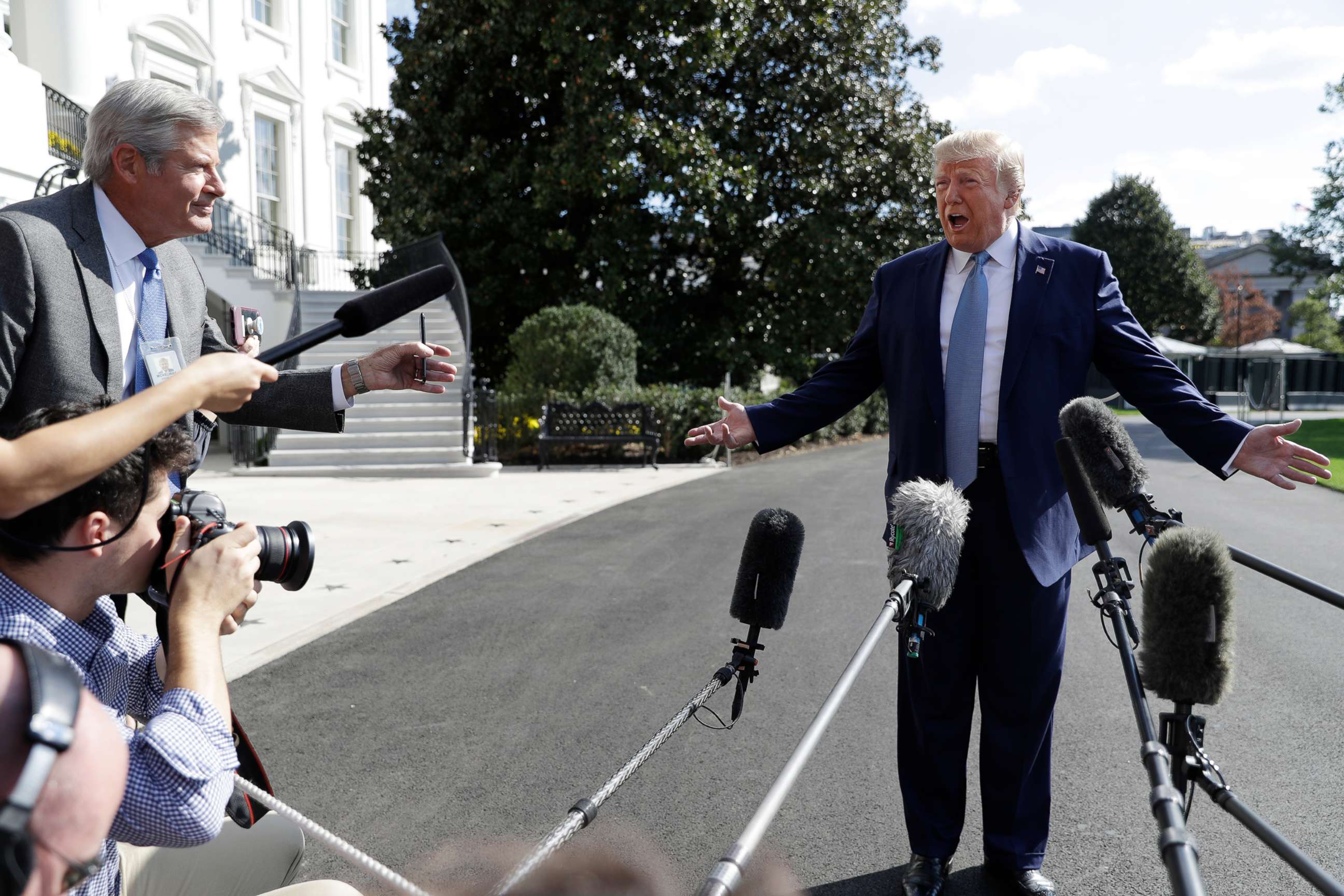 PHOTO: President Donald Trump talks to reporters on the South Lawn of the White House, Oct. 4, 2019, in Washington.