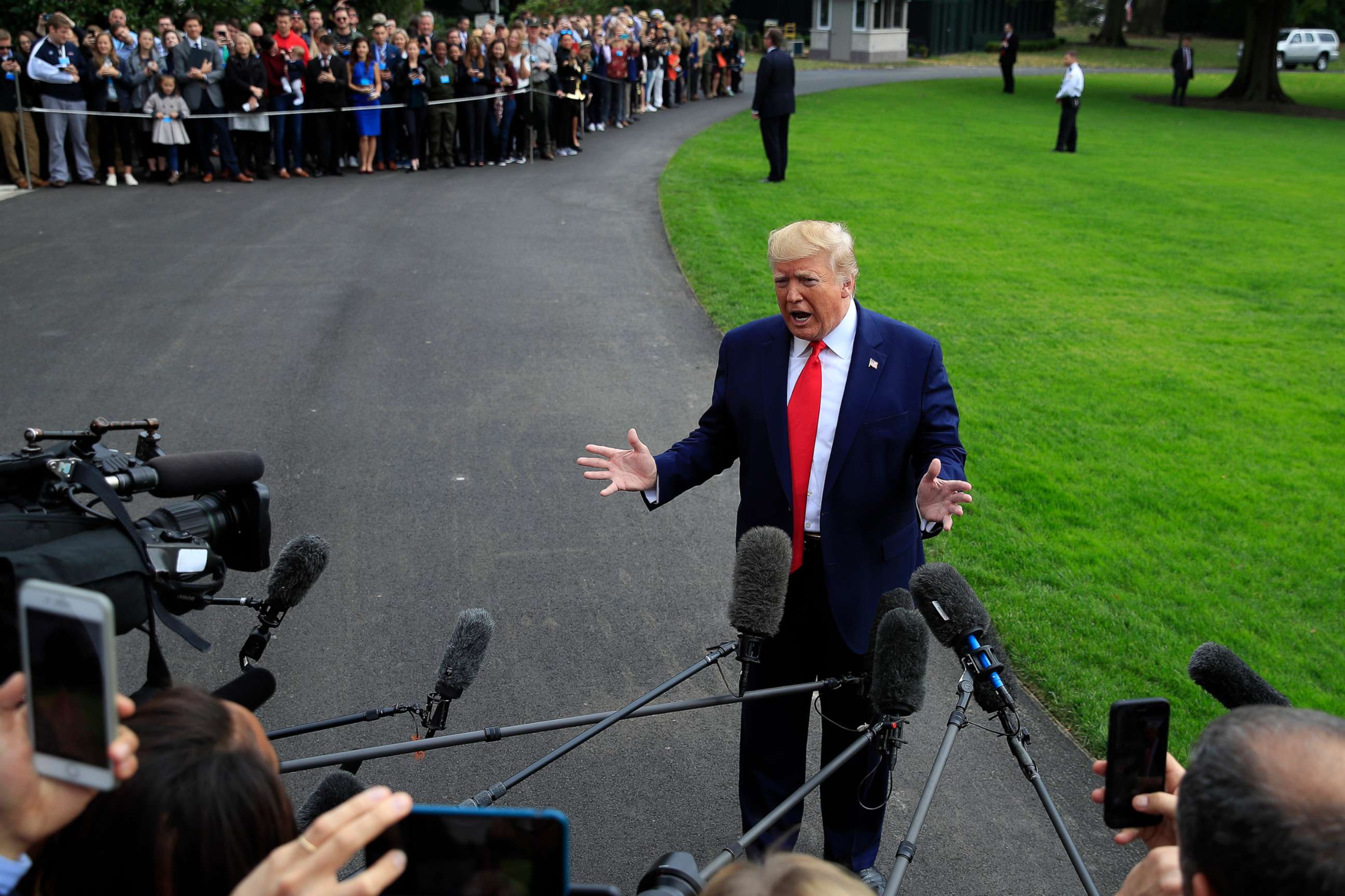 PHOTO: President Donald Trump speaks to reporters as he leaves the White House, Oct. 25, 2019, in Washington, to travel to South Carolina.