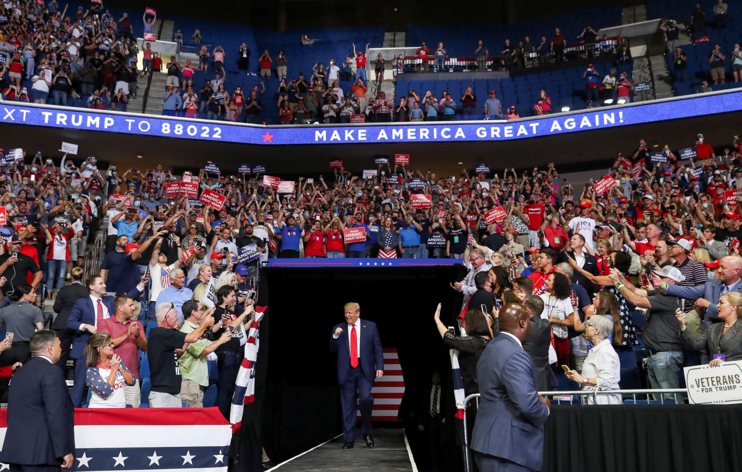 PHOTO: President Donald Trump pumps his fist as he enters his first re-election campaign rally in several months in the midst of the coronavirus disease (COVID-19) outbreak, at the BOK Center in Tulsa, Oklahoma, June 20, 2020.